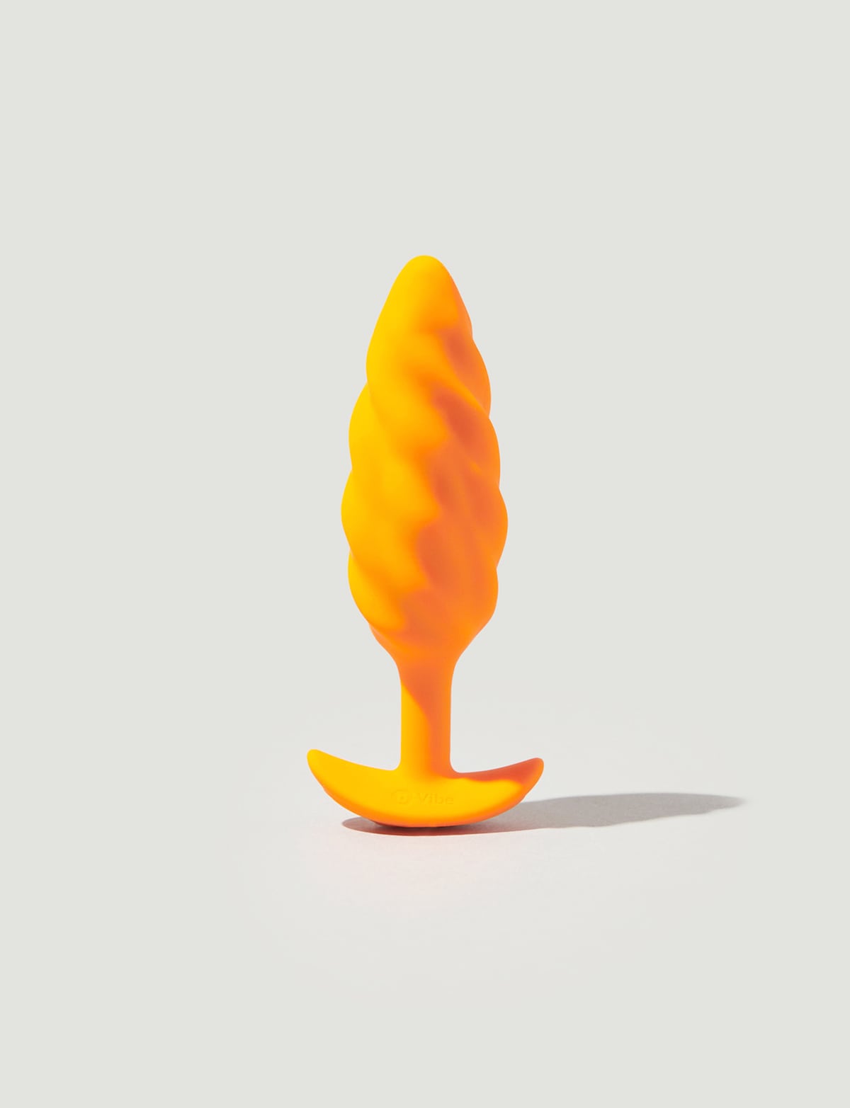 Swirl Texture Plug - bVibe Vibrating Swirl Texture Butt Plug Orange